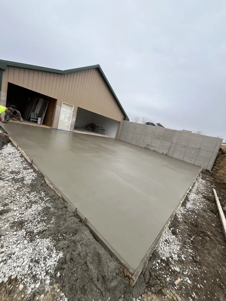 Finished concrete shop slab at the open bay of a pole barn, Medina Concrete job