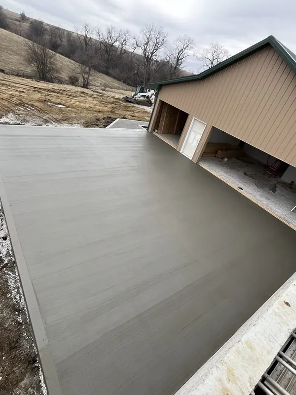 Freshly poured concrete shop floor in front of a pole barn, Medina Concrete job